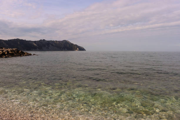 Portonovo beach with view of Mount Conero (Marche, Italy). Portonovo beach inside the Conero Regional Park.