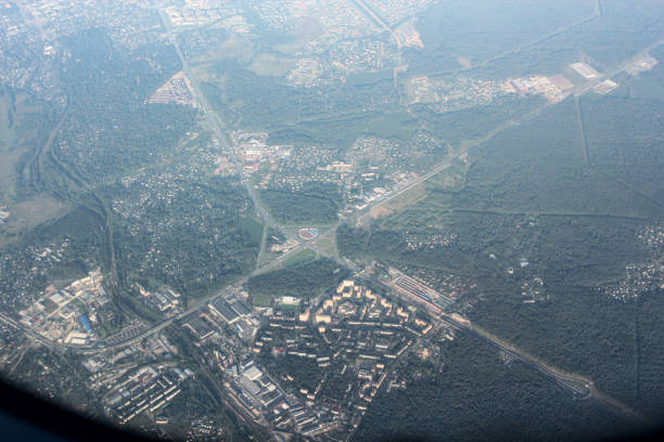 Views from the airplane window onto the landscapes of the earth beneath the wing.