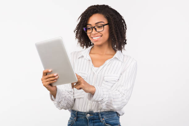 istock African american girl in eyewear using digital tablet 2178584036
