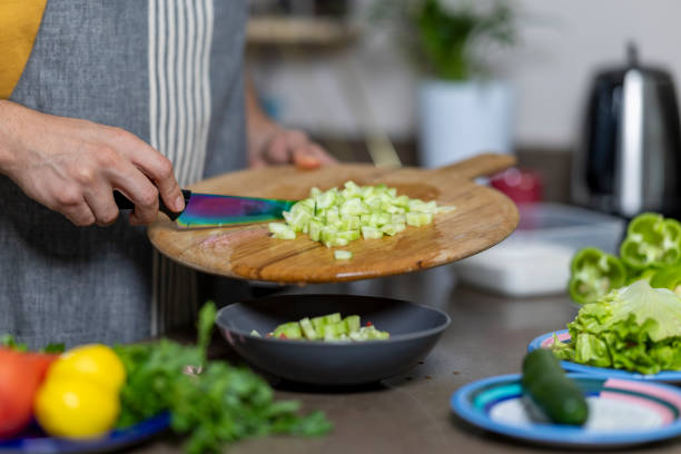 istock Unknown man makes healthy green salad at home 2178585320
