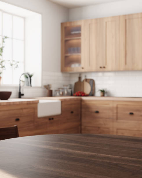 istock This chic wooden kitchen showcases a spacious dining area that is filled with an abundance of natural light 2178587584