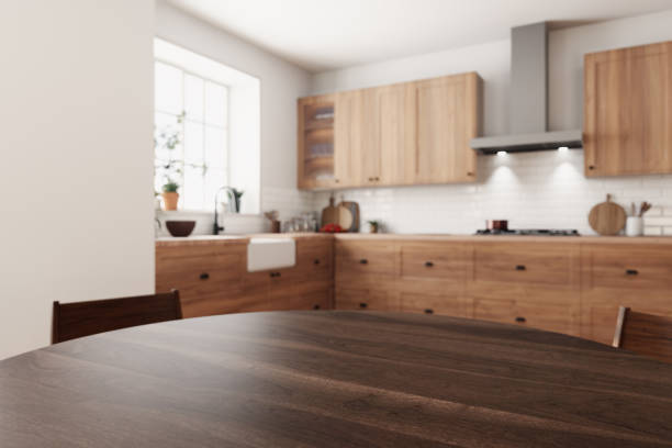 istock This chic wooden kitchen showcases a spacious dining area that is filled with an abundance of natural light 2178587585