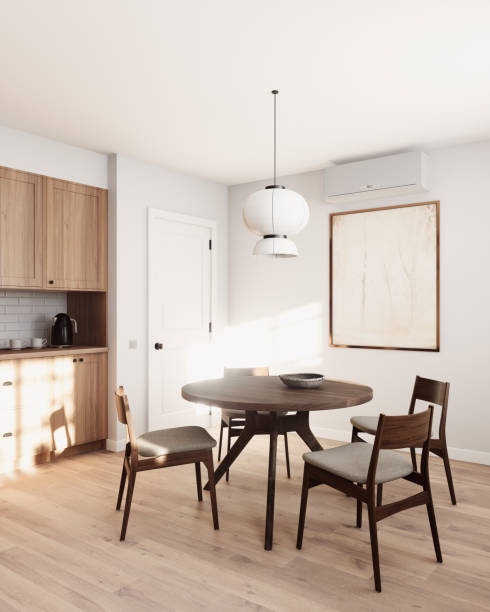 istock A stylish modern dining room featuring a round wooden table and sleek chairs, illuminated by soft natural light. 3d render 2178587588