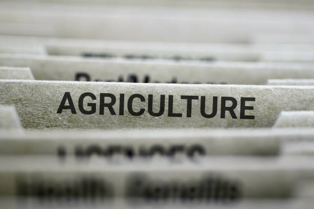 File folders labeled 'AGRICULTURE' in an office.
