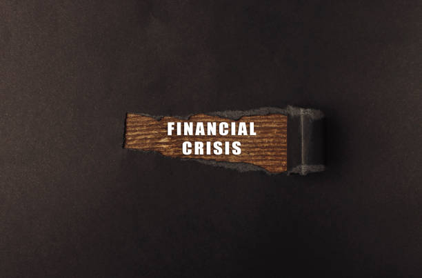 istock Wooden object with the words financial crisis written on it 2178589190