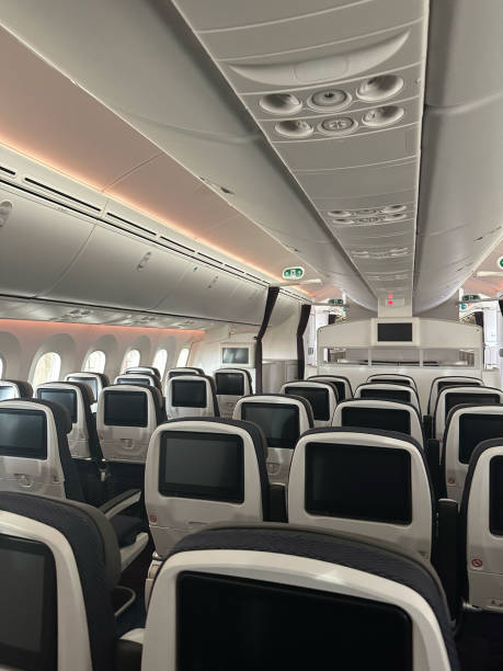 istock Passenger airplane interior main cabin seats 2178590040