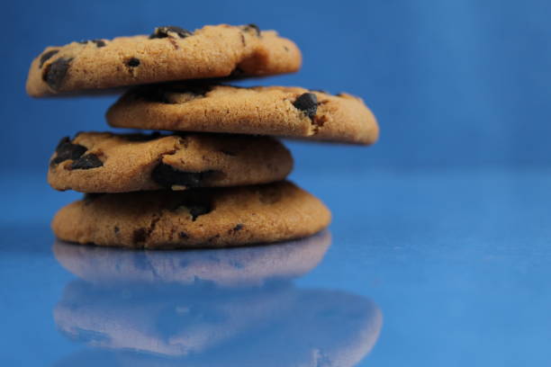 cookies with chocolate chips on a blue background, side view. Homemade cakes.