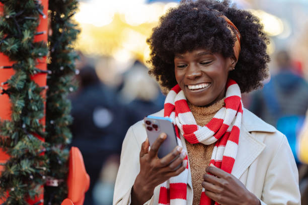 istock Joyful woman smiling outdoors in a festive holiday setting 2178592110