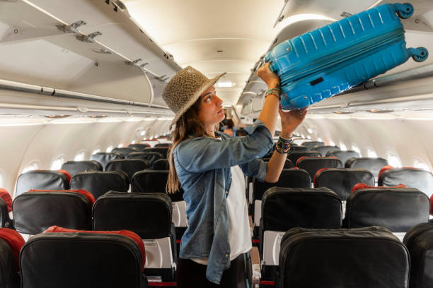 istock Woman placing luggage 2178592126