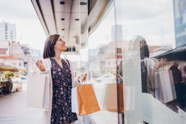 istock Happy young woman enjoying in shopping 2178593433