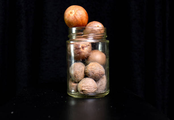 avocado seeds stored in a glass jar