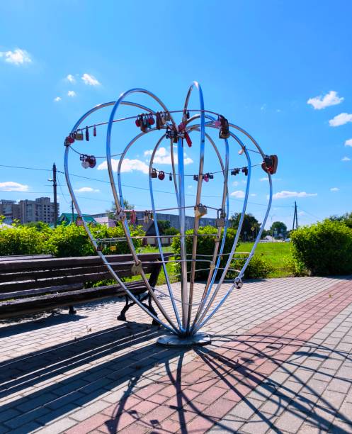 istock Decorative wedding locks on a wrought iron volumetric heart on a park alley 2178595875