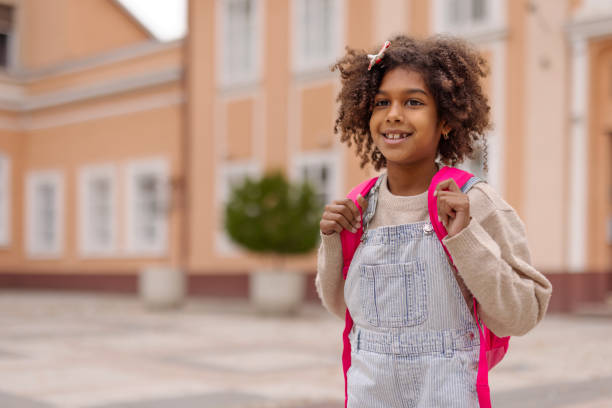 istock Cheerful African American Primary School Girl With Backpack 2178597611