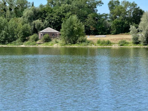 istock wooden cabin by a lake 2178600481