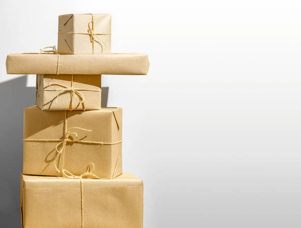 istock Stylish Wrapped and stacked Gift Boxes on white background 2178600764