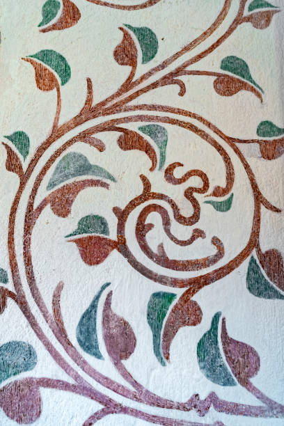Beautiful medieval floral wall paintings. Flower patterns and ornaments, ancient interior decorations in the gothic church