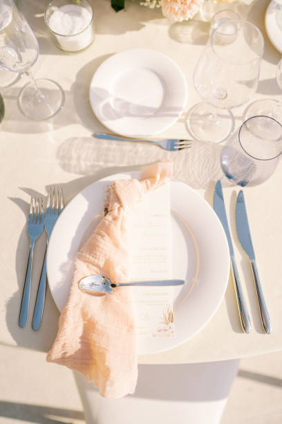 istock Festive menu lies on a plate with a napkin on a set table. Top view 2178602187