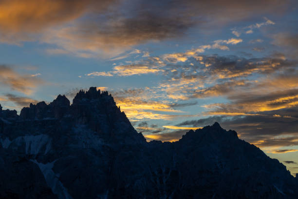istock Sunset sky in the mountains. Dolomiti Alps range at sunset light, the sky burning blood red 2178602897