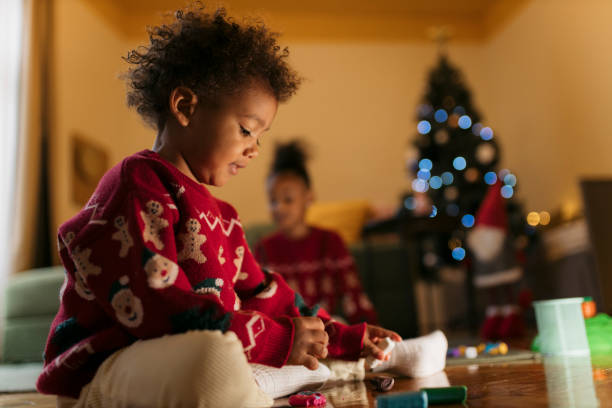 istock Small boy playing with colorful clay dough during Christmas at home 2178604816
