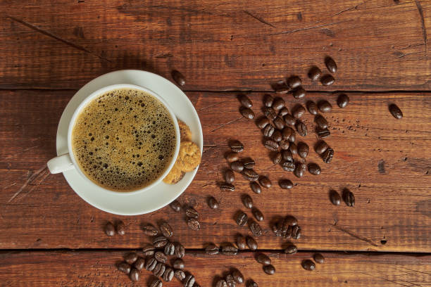 istock Gourmet coffee cup and beans on an old wooden background 2178608443