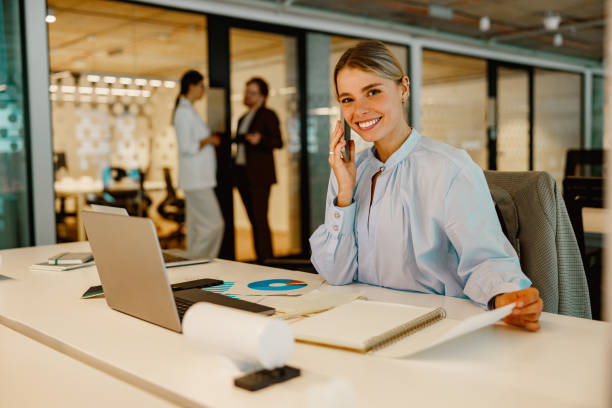 istock A Professional Woman Engaged in Work Activities within a Modern Office Environment 2178610328