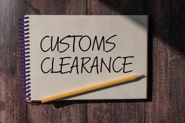 istock CUSTOMS CLEARANCE text on a sticky on chart with pencil. 2178610592