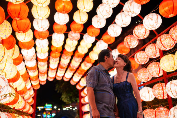 istock Romantic senior couple under colorful lanterns 2178616596