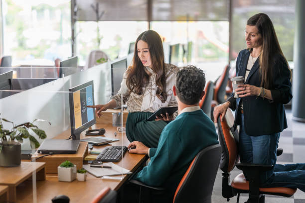 istock Diverse Team Engages in Productive Collaboration at Office Workstations 2178618291