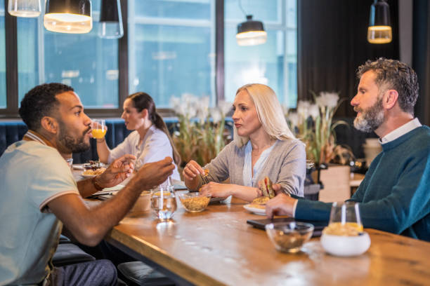 istock Diverse Team Engaging in Business Discussion Over Coffee 2178618342