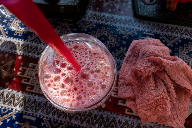 Baku, Azerbaijan A glass of fresh squeezed pomegranate juice in the sun.