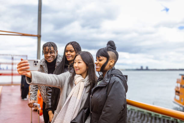 istock Diverse Group of Students Enjoying a Ferry Ride in New York 2178619121