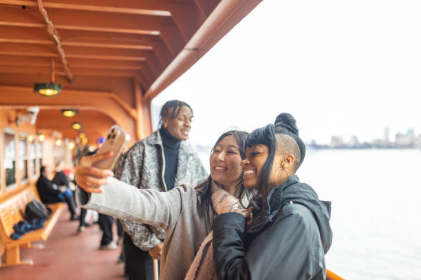 istock Diverse Group of Students Enjoying Ferry Ride with Selfie 2178619124