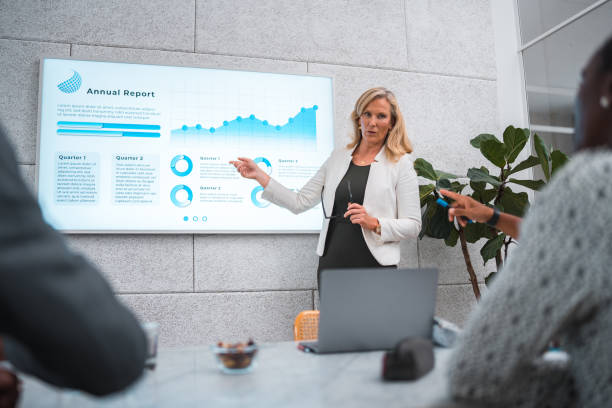 istock Mature Businesswoman's Expert Presentation in a Modern Boardroom 2178619476