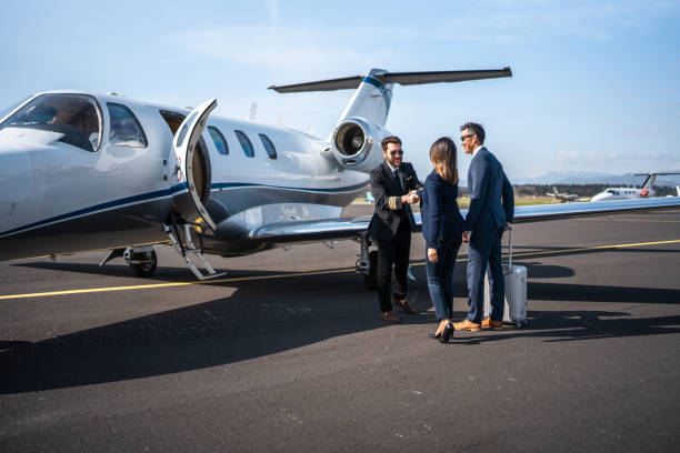 istock Asian Executives Meet Private Jet Pilot at Airfield 2178619703