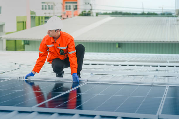 istock engineer man inspects construction of solar cell panel or photovoltaic cell by electronic device. Industrial Renewable energy of green power. factory worker working on tower roof. 2178620827