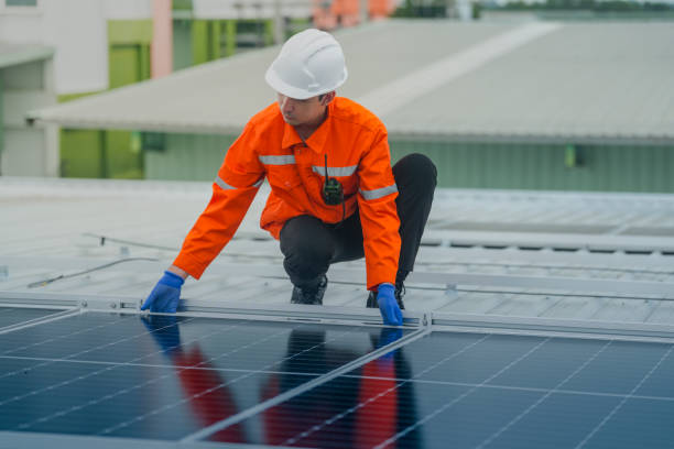 istock engineer man inspects construction of solar cell panel or photovoltaic cell by electronic device. Industrial Renewable energy of green power. factory worker working on tower roof. 2178621103
