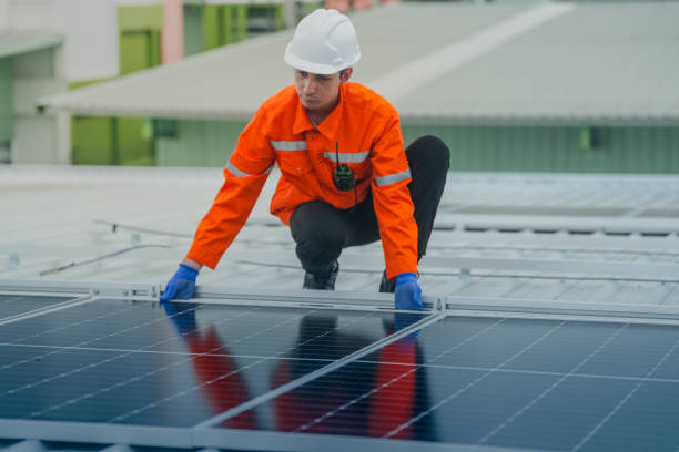 istock engineer man inspects construction of solar cell panel or photovoltaic cell by electronic device. Industrial Renewable energy of green power. factory worker working on tower roof. 2178621189