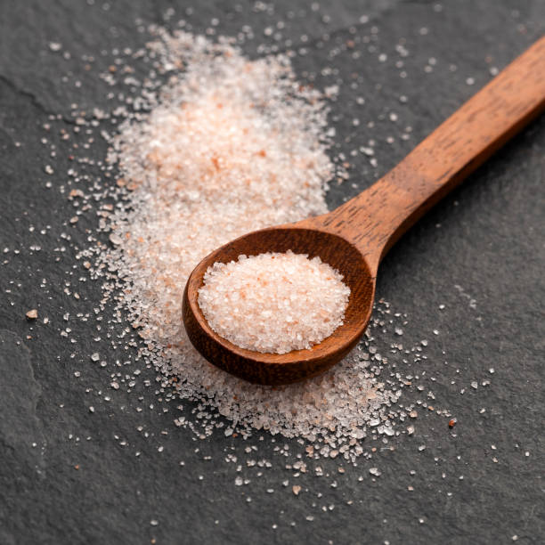 istock Pink Himalayan salt in spoon - Fine crystals sprinkled. 2178621867