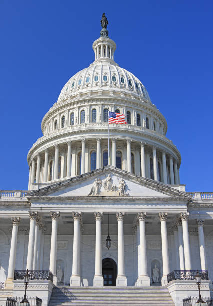 istock US Capitol in Washington DC with blue sky background 2178623346