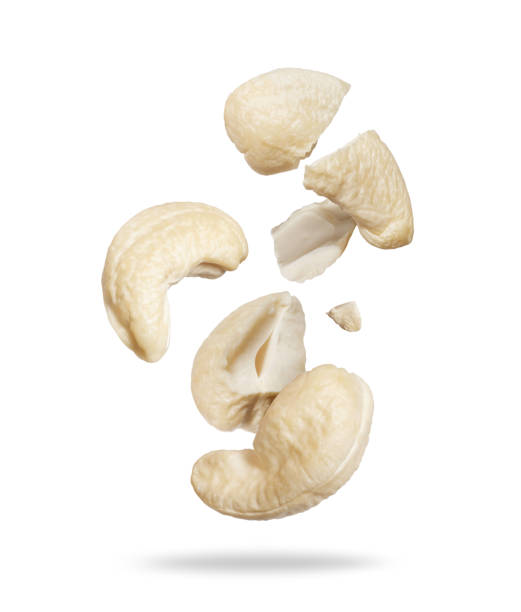 istock Whole and cracked dried cashew close-up on a white background 2178626709