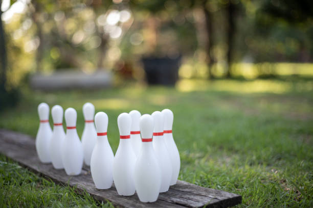istock set of bowling pins on the grass 2178626816