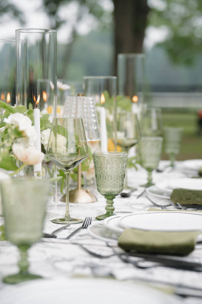 istock Green Wedding Day Reception Tablescape Centerpieces White Flowers 2178629892