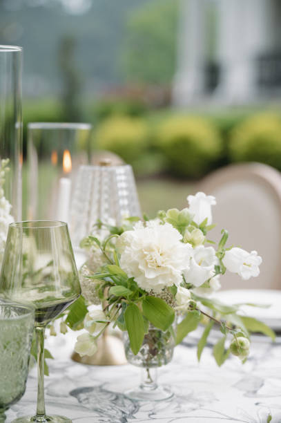 istock Green and White Wedding Day Reception Tablescape Centerpieces Design 2178630490
