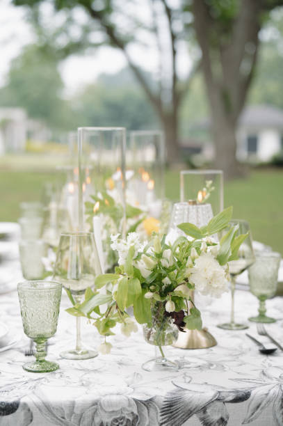 istock Green and White Wedding Day Reception Tablescape Centerpieces Design 2178630526