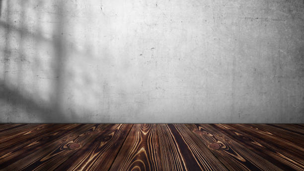 istock Empty wooden table top with white and grey concrete wall. Abstract pattern of concrete wall 2178633592