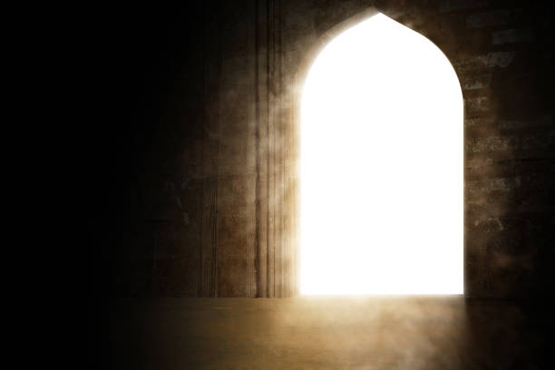 istock White archway of mosque door with shining light through it 2178634209