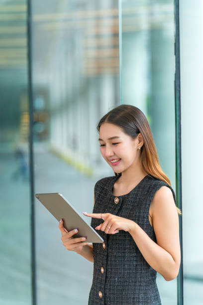 istock Young Asian Businesswoman Using A Tablet 2178636483