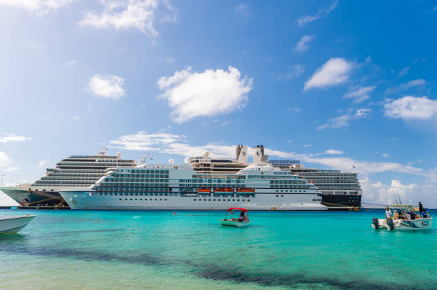 A view of the sun shining down on the Caribbean Sea from a cruise ship deck