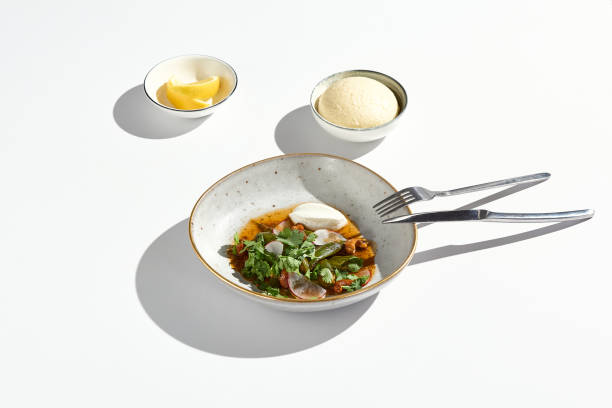 istock Minimalist Aesthetic Smashed Cucumbers with Cashews and Tofu Dish in Bright Neutral Setting 2178637919