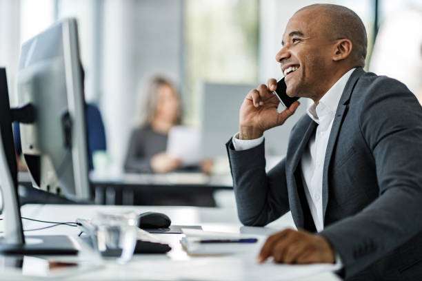 istock Happy black businessman talking on cell phone in the office. 2178646273